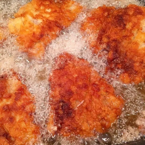 frying round steaks in hot oil