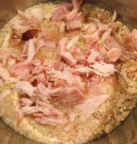 Adding chicken pieces added to rice mixture