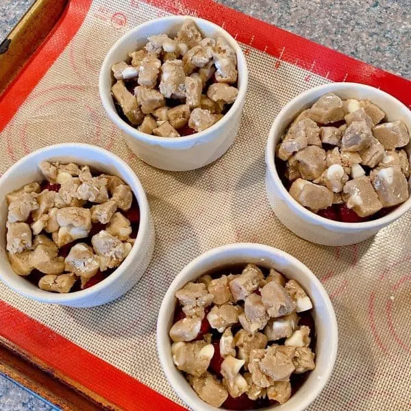 Topping each Ramekin with cookie crumbles