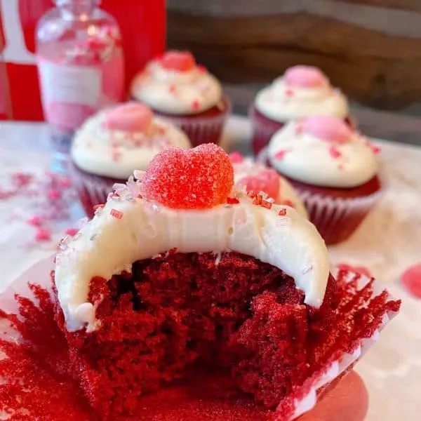 Red Velvet Cupcake with bite out of it.