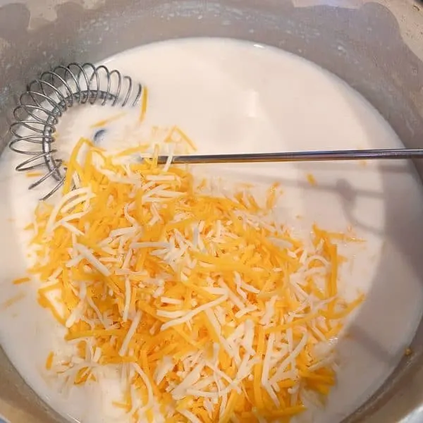 Making cheese sauce in small sauce pan