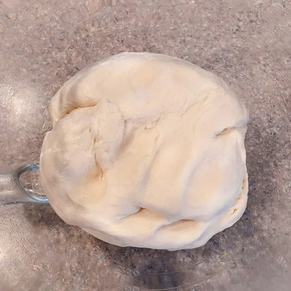 dough placed in oil bowl