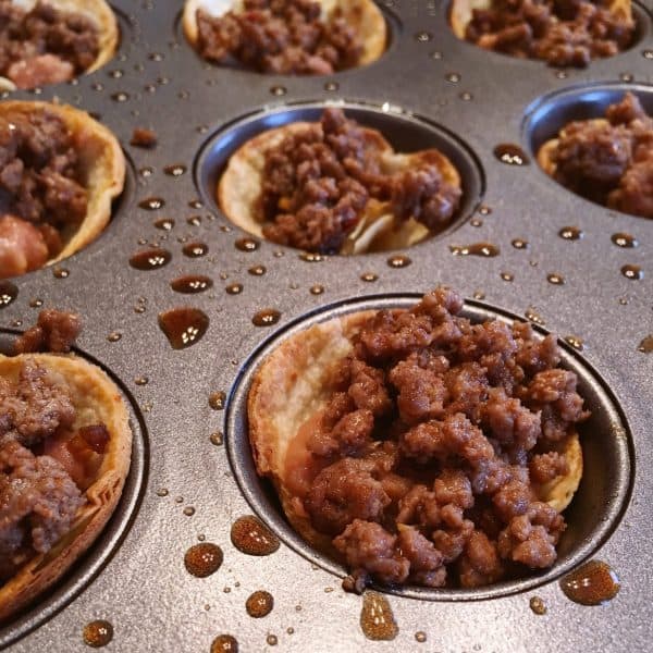filling tostada cups with ground beef