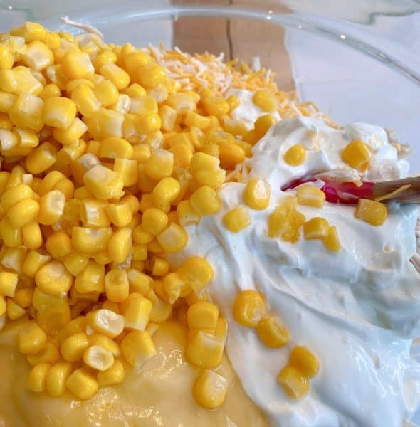 adding drained corn to chicken and soup mixture