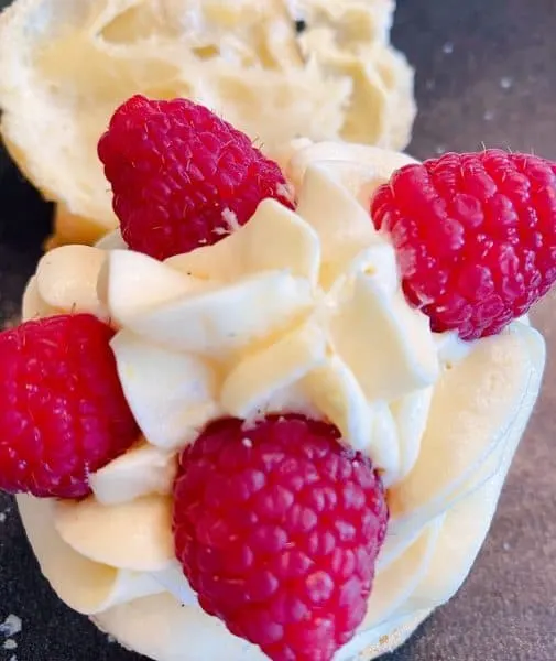 Adding Fresh Raspberries to cream filling