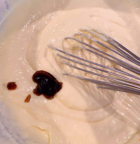 adding vanilla past to cream 