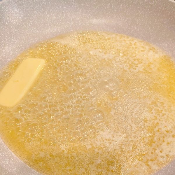melted butter in skillet over medium heat