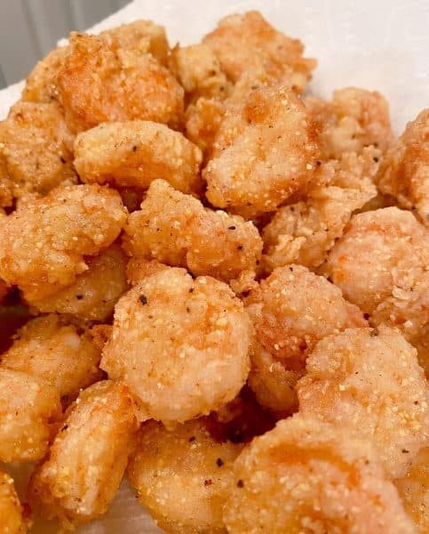 fried shrimp draining on paper towel