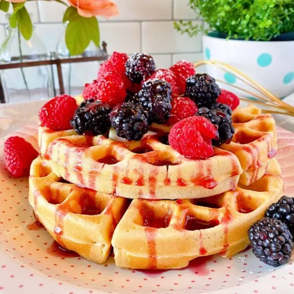 Stacked belgian waffles with berries