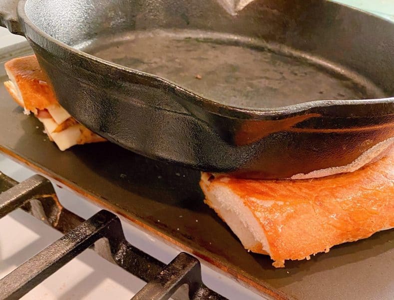 grilling sandwich by pressing with cast iron skillet