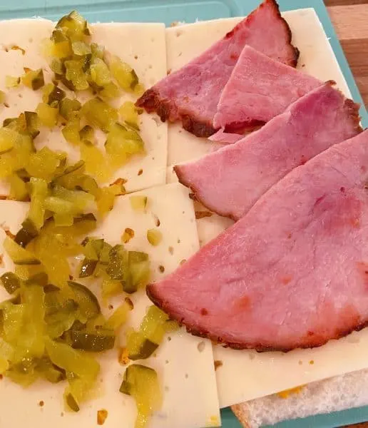 Layering pickles and Ham on sandwich