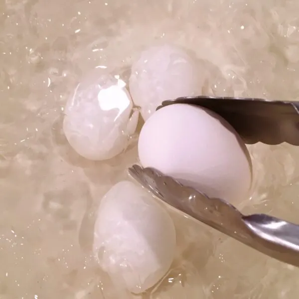 placing the eggs in an ice water bath