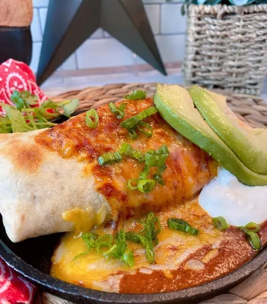 Oven Fried Chimichanga on plate with avocado and sour cream