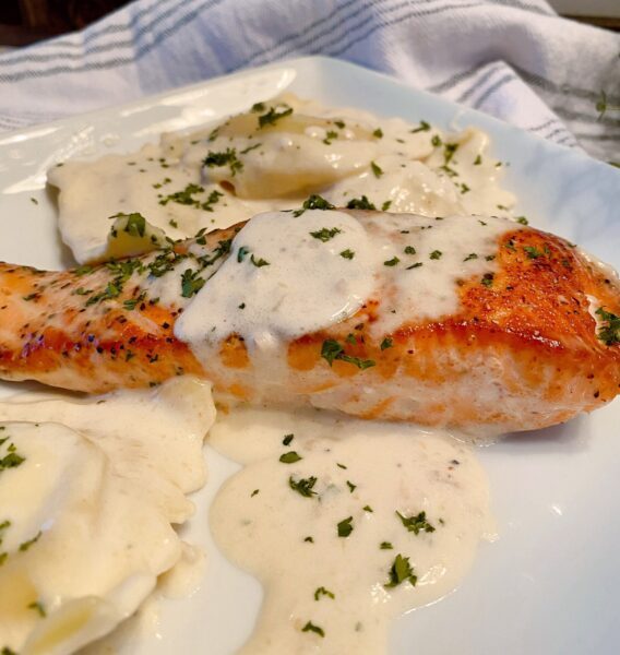 Creamy Tuscan Salmon with Lobster Ravioli