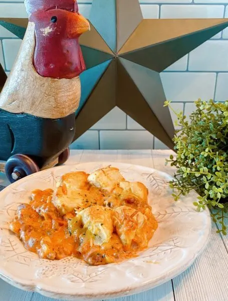 Dinner plate filled with Cowboy Casserole on kitchen counter.