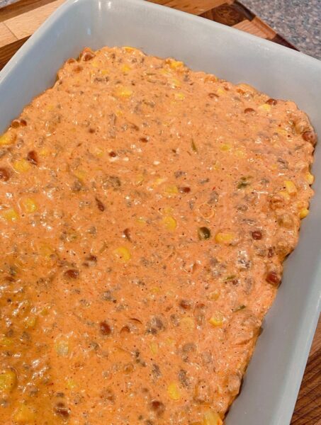 Pour ground beef filling into 9 x 13 casserole dish.