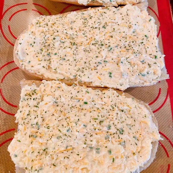 Garlic Cheesy spread on top of french bread