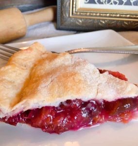 Slice of Purple Plum Pie with a fork