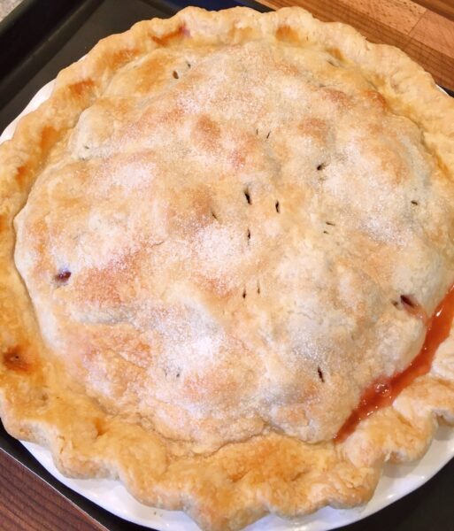 Baked pie cooling on a rack, before serving.