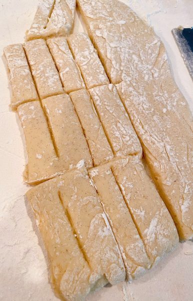 Dough cut into bars and tops scored.