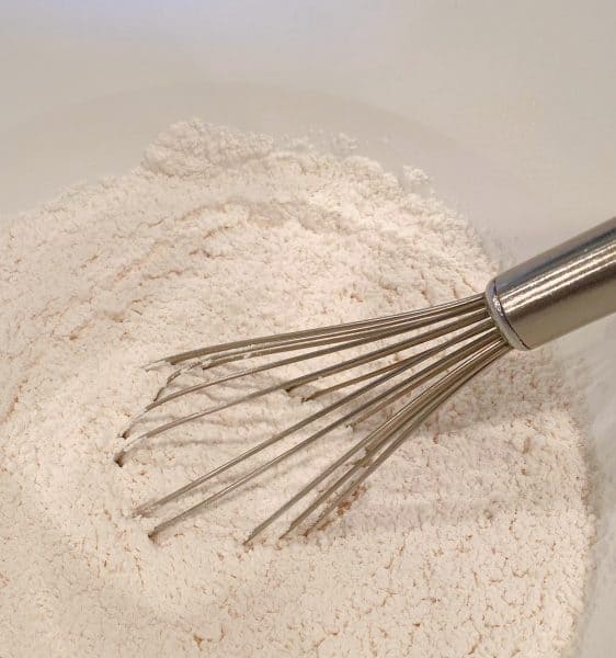 Flour, baking powder, baking soda, and salt in a bowl 