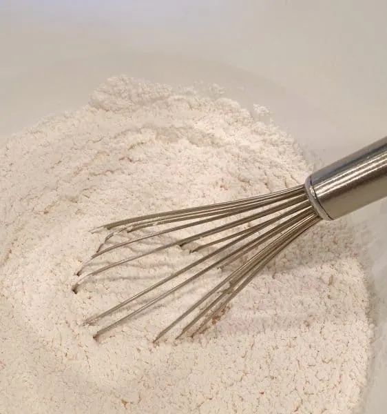 Flour, baking powder, baking soda, and salt in a bowl 