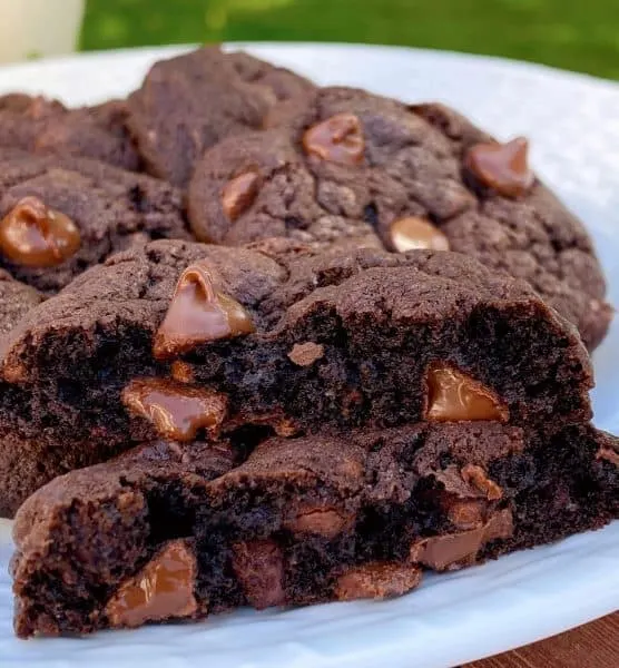 Double Chocolate Chip Cookies broken in half to show off the center of the cookies