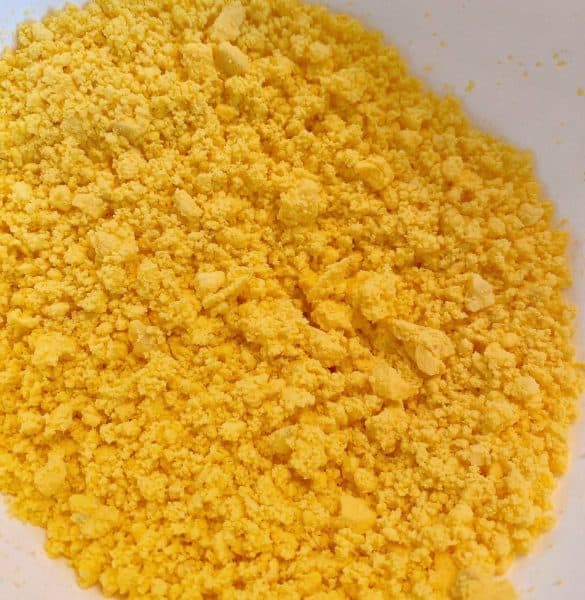 Egg yolks in a bowl crumbled