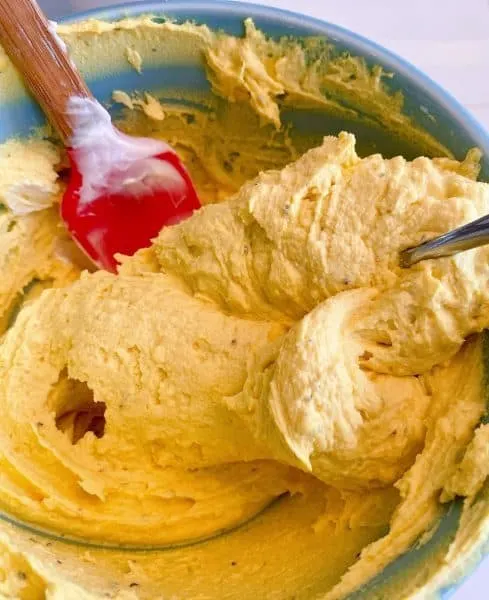 yolk filling being mixed in a bowl until creamy