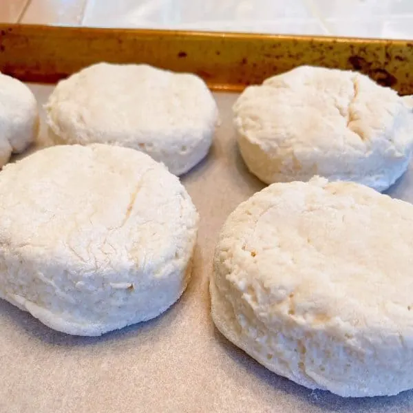 Biscuits on baking sheet ready to bake.