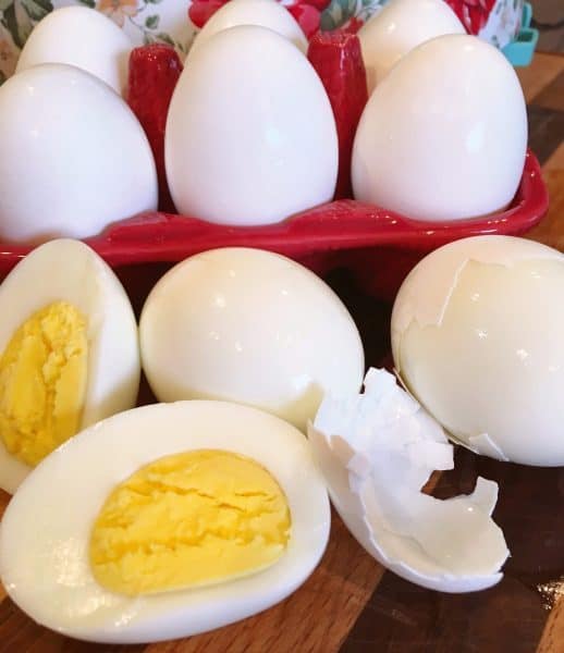 Hard boiled eggs with one cut open. 