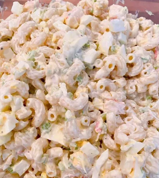 Seafood Macaroni Salad mixed in a bowl and ready to chill in the refrigerator.