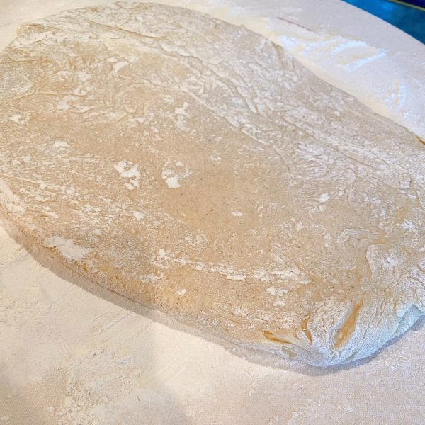 Dough for buttermilk bars patted into a rectangle