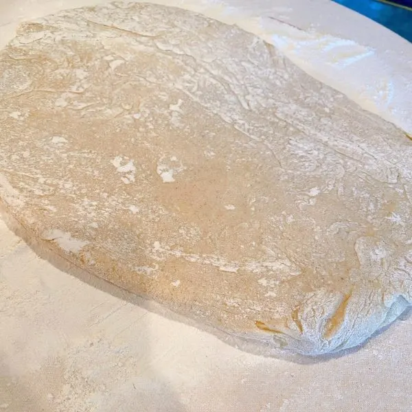 Dough for buttermilk bars patted into a rectangle