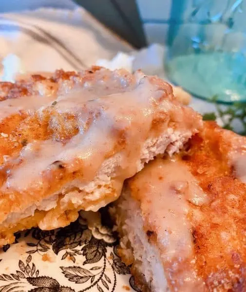 Photo of the inside of the cubed pork steak with gravy.