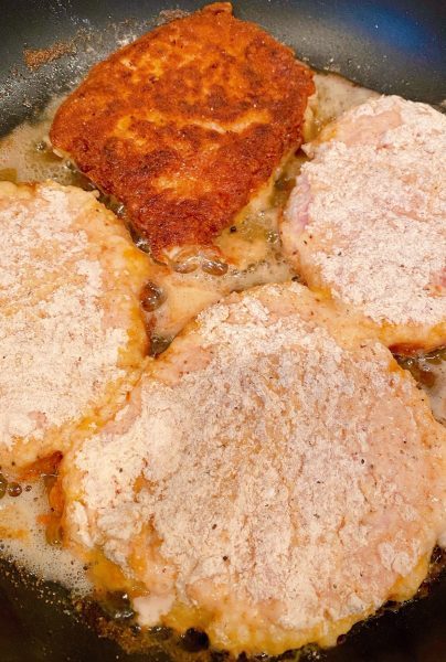 Frying Pork Cube Steaks in skillet over medium high heat.