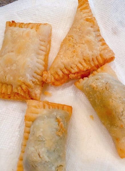 Hand Pies on paper towel lined baking rack. 