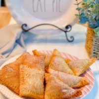 Plate filled with homemade fresh peach hand pies