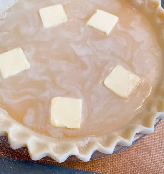 Pats of butter in water pie filling