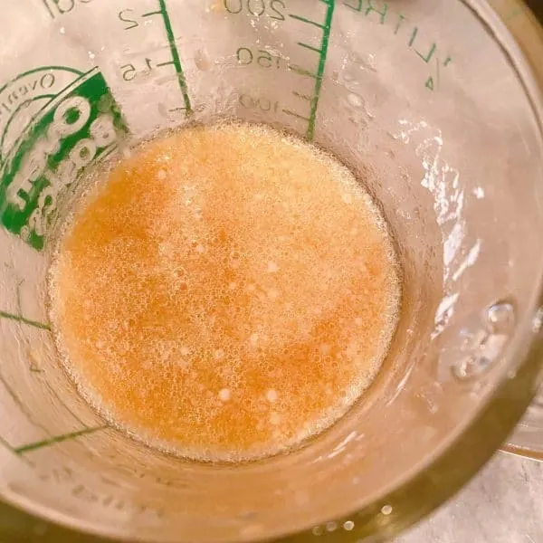 Water and Cornstarch combined in a small measuring cup.