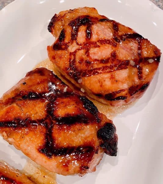 Pork Chops on a white plate.