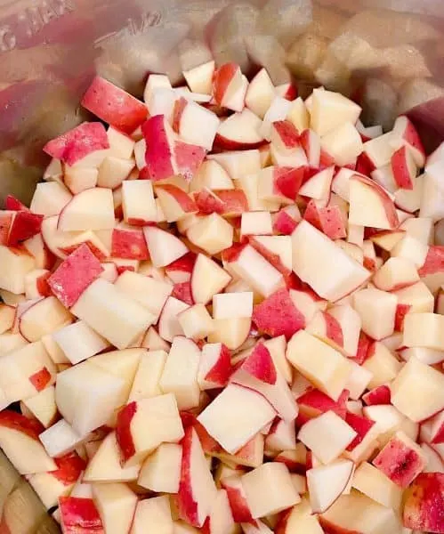 Red Potatoes Cut Into small bite size pieces and placed in the bottom of the Instant Pot.