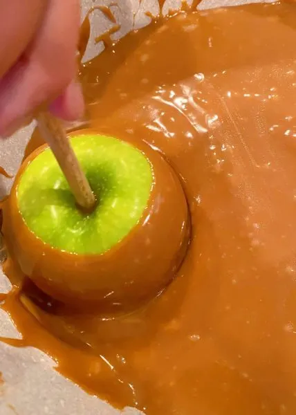 Dipping the Apples into the warm caramel