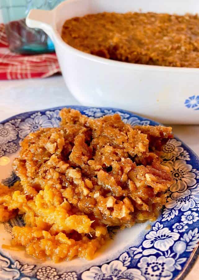 Blue and White plate with Sweet Potato Pecan Casserole on the plate. 