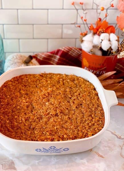 Baked Sweet Potato Pecan Casserole pulled right out of the oven in a casserole dish.