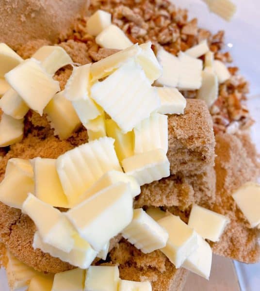 Bowl with butter, brown sugar, and pecans ready to be mixed for crumb topping.