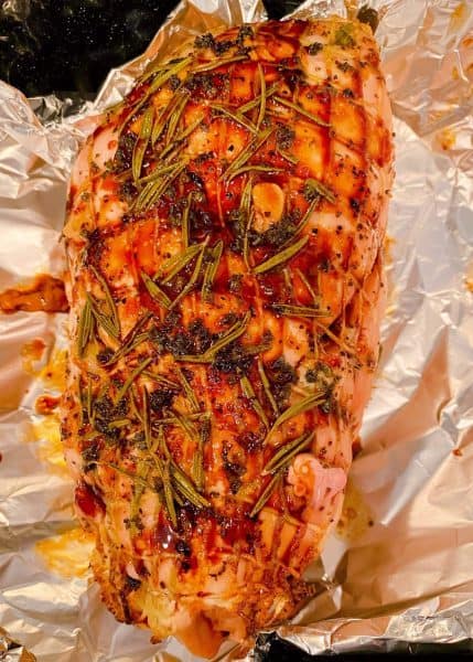 Roast being prepared to wrap in the foil.