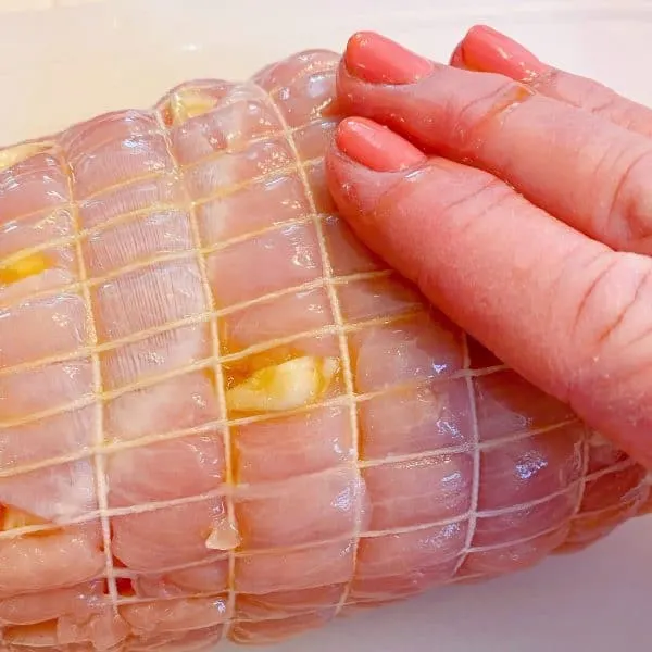 Rubbing the Olive oil into the top of the Turkey Roast. 