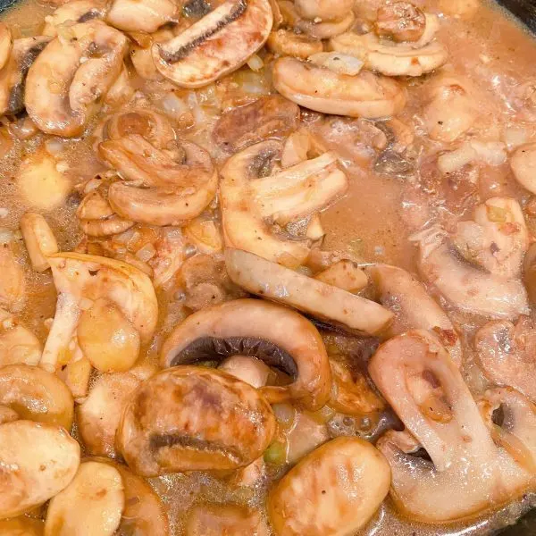 mushroom cooking in pan juices 