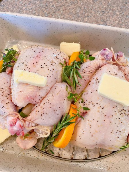 Adding butter to tops of hens